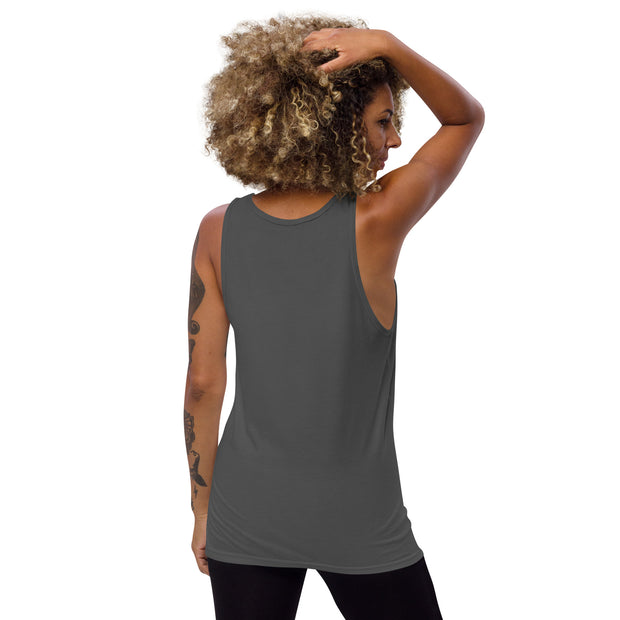 A women wearing a grey tank top showing the back of tank top and arm up to show arm opening of the shirt.
