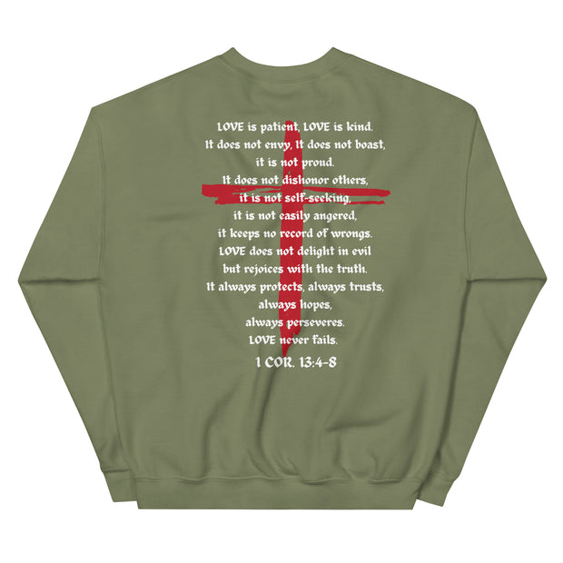 Back of military green sweater with LOVE scriptures printed and red Jesus cross in the background.