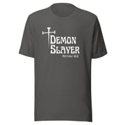 Grey t-shirt that has a white cross then reads Demon Slayer in white text and Matthew 10:8 in grey text.
