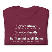 Folded maroon unisex t-shirt that has the scripture, 1 Thessalonians 5:16-5:18, Rejoice Always, Pray Continually, Be Thankful in All Things