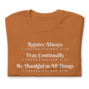 Light brown unisex t-shirt that has the scripture, 1 Thessalonians 5:16-5:18, Rejoice Always, Pray Continually, Be Thankful in All Things