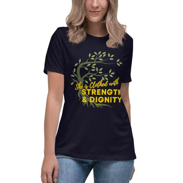 Young women wearing navy t-shirt with image of tree branched over the scripture "She is clothed with strength and dignity" Proverbs 31:25. Tree is dark olive with green leaves. Lettering is yellow.